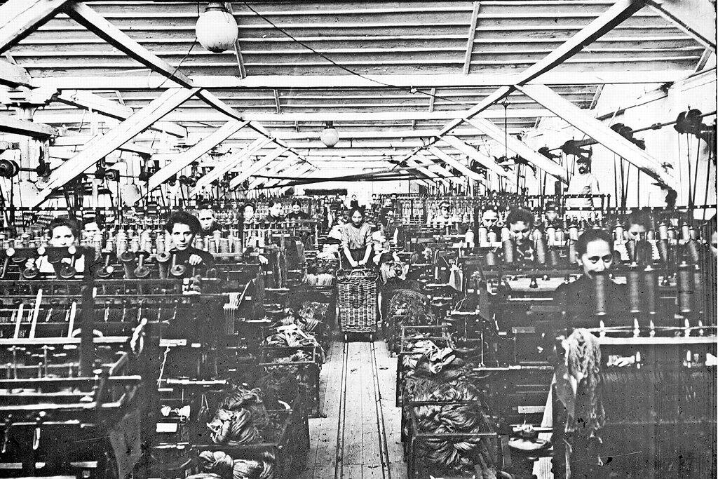 Photo from around 1900 showing textile workers in a factory building